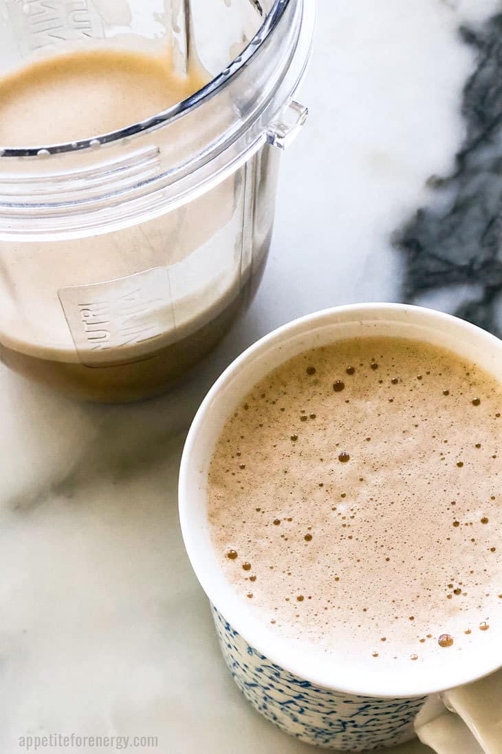 Creamy Bulletproof Coffee in a mug and the blender cup with extra coffee