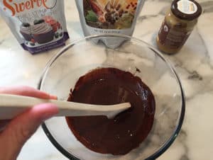 Stirring in the peanut butter and erythritol
