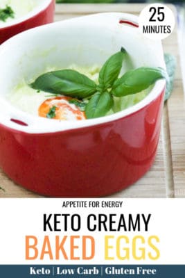 Creamy baked eggs in a red ramekin, served with basil