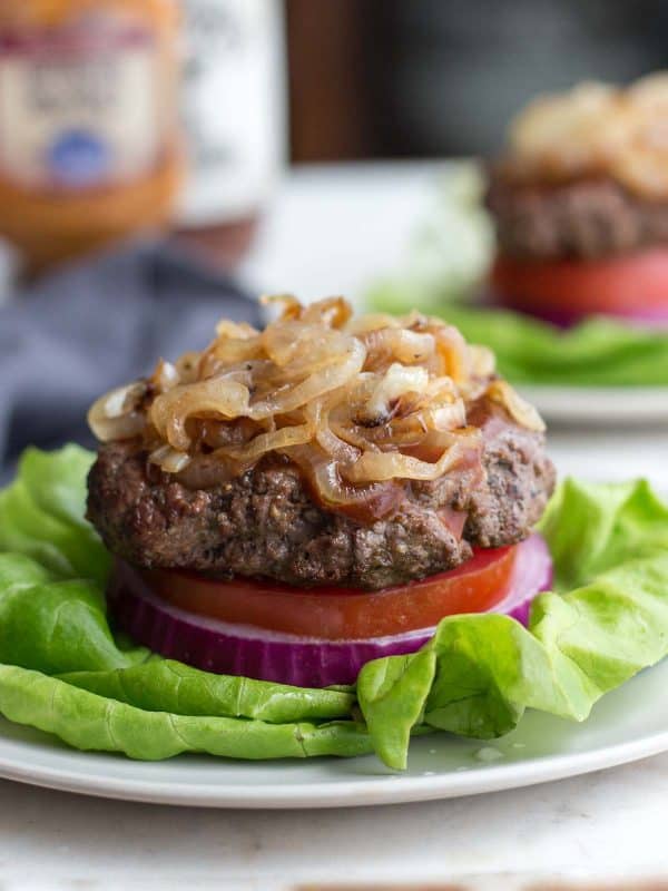 Low-carb steakhouse burger on a bed of lettuce