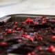 Low-Carb Salted Raspberry Chocolate Bark broken up on the tray