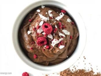 Quick Keto Chocolate Pudding (10 minutes) served with raspberries and coconut flakes
