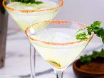 Low-Carb Spicy Margarita in a martini glass with cilantro garnish