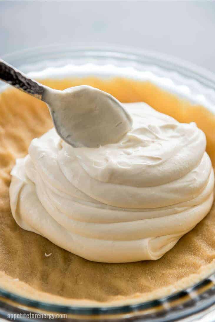 Adding the cream cheese layer to the base of Key Lime Pie Icebox cake