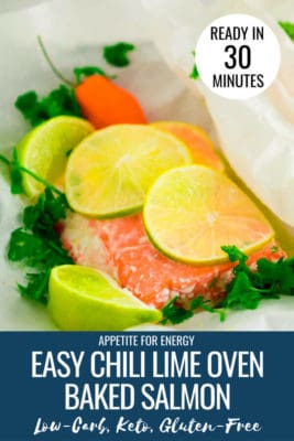 Chili Lime Oven Baked Salmon in the parchment paper that it cooks in, with fresh lime
