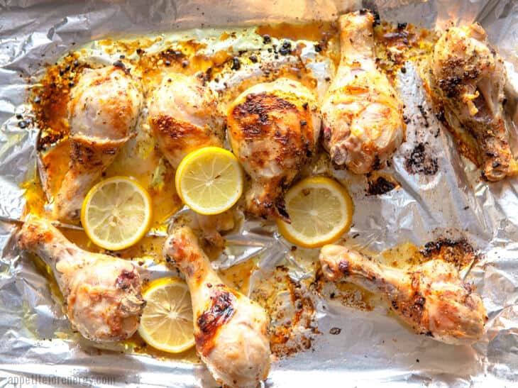 Baking 30-Minute Herb Roasted Chicken Drumsticks on a baking sheet covered in foil