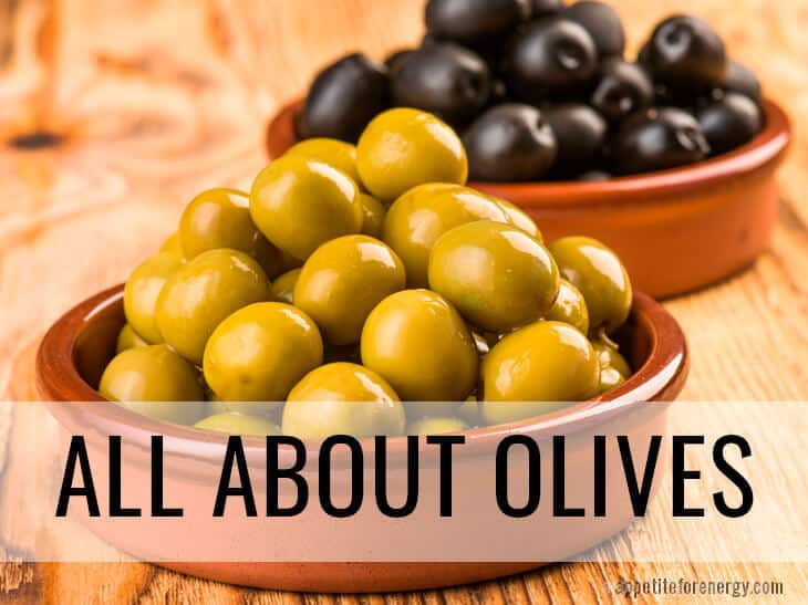 Green olives and black olives in terracotta dishes