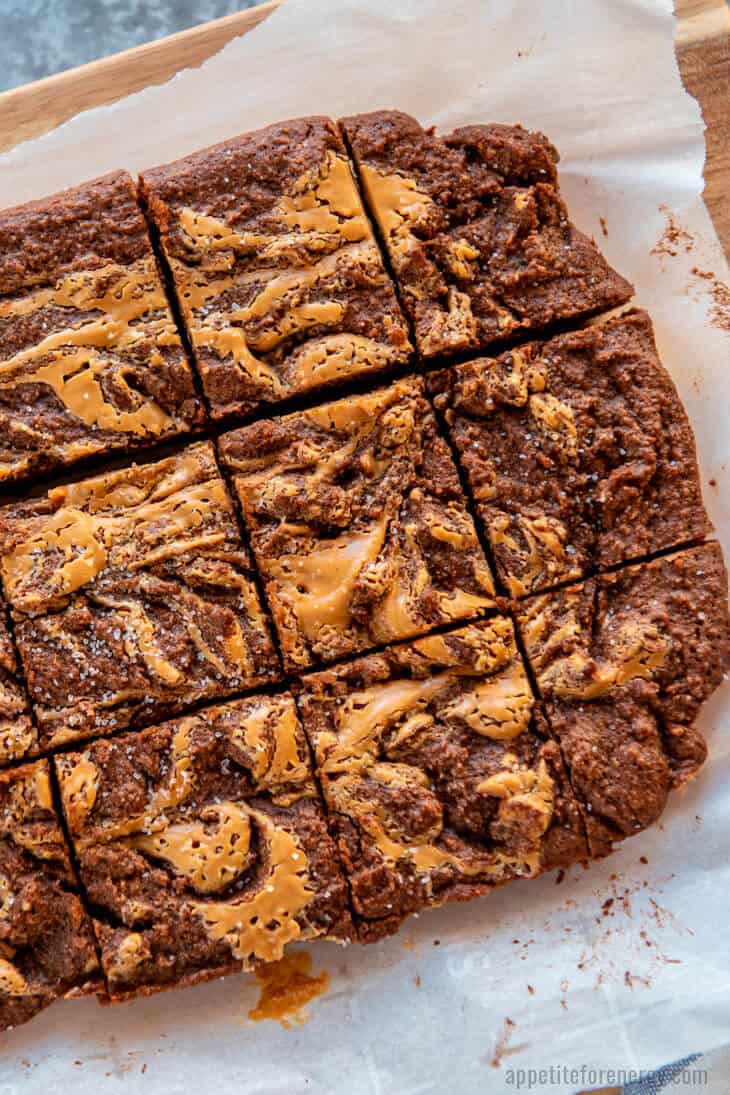 Keto Peanut Butter Brownie slab cut into pieces on baking paper