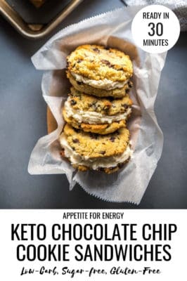Three Keto Chocolate Chip Cookie Sandwiches arranged in a tray with parchment paper