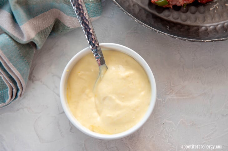 Mix mayo and mustard to make sauce for keto pork burgers