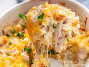 A serving of KETO Chicken Cauliflower Rice Casserole with melted cheese