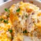 A serving of KETO Chicken Cauliflower Rice Casserole with melted cheese
