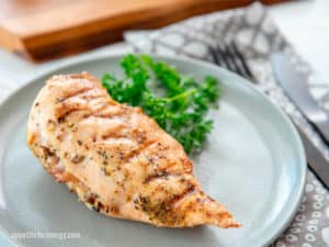 KETO Grilled Mushroom Stuffed Chicken Breast on grey plate with parsley